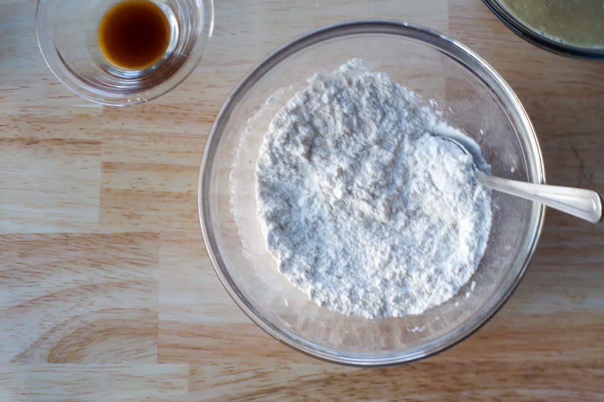 flour and baking soda sifted together in medium glass bowl