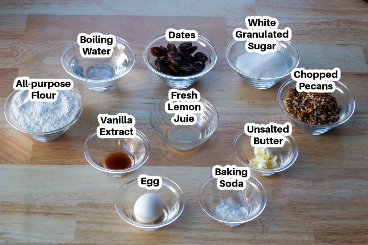 ingredients in date nut loaf in glass bowls, labelled