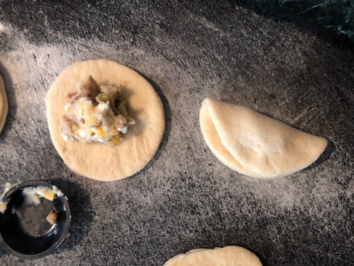 pull one edge down over the other