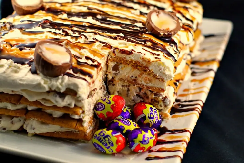 Mini Easter Creme eggs in front of cut out section of cake