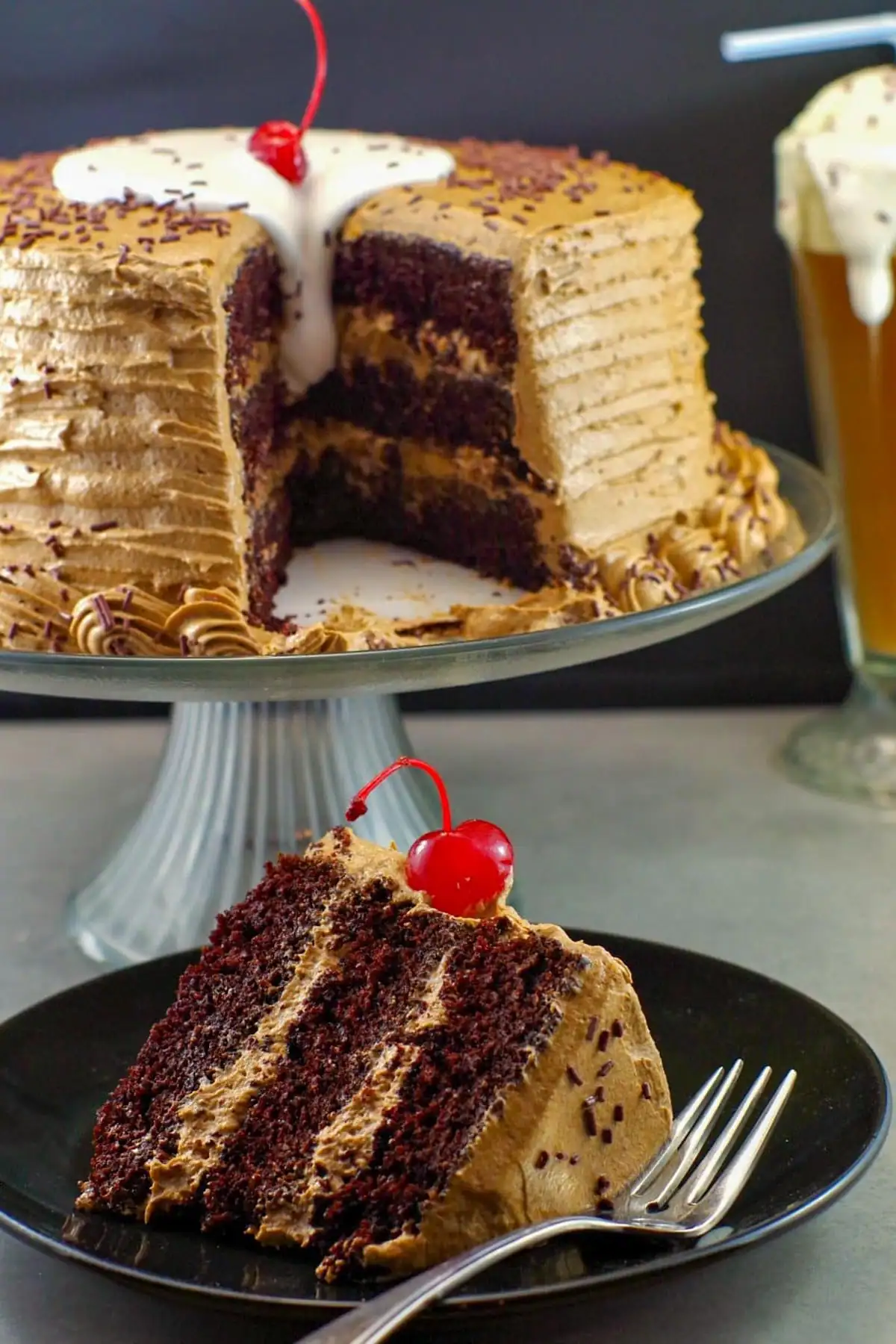 piece of root beer float cake in foreground with remainder of cake in background