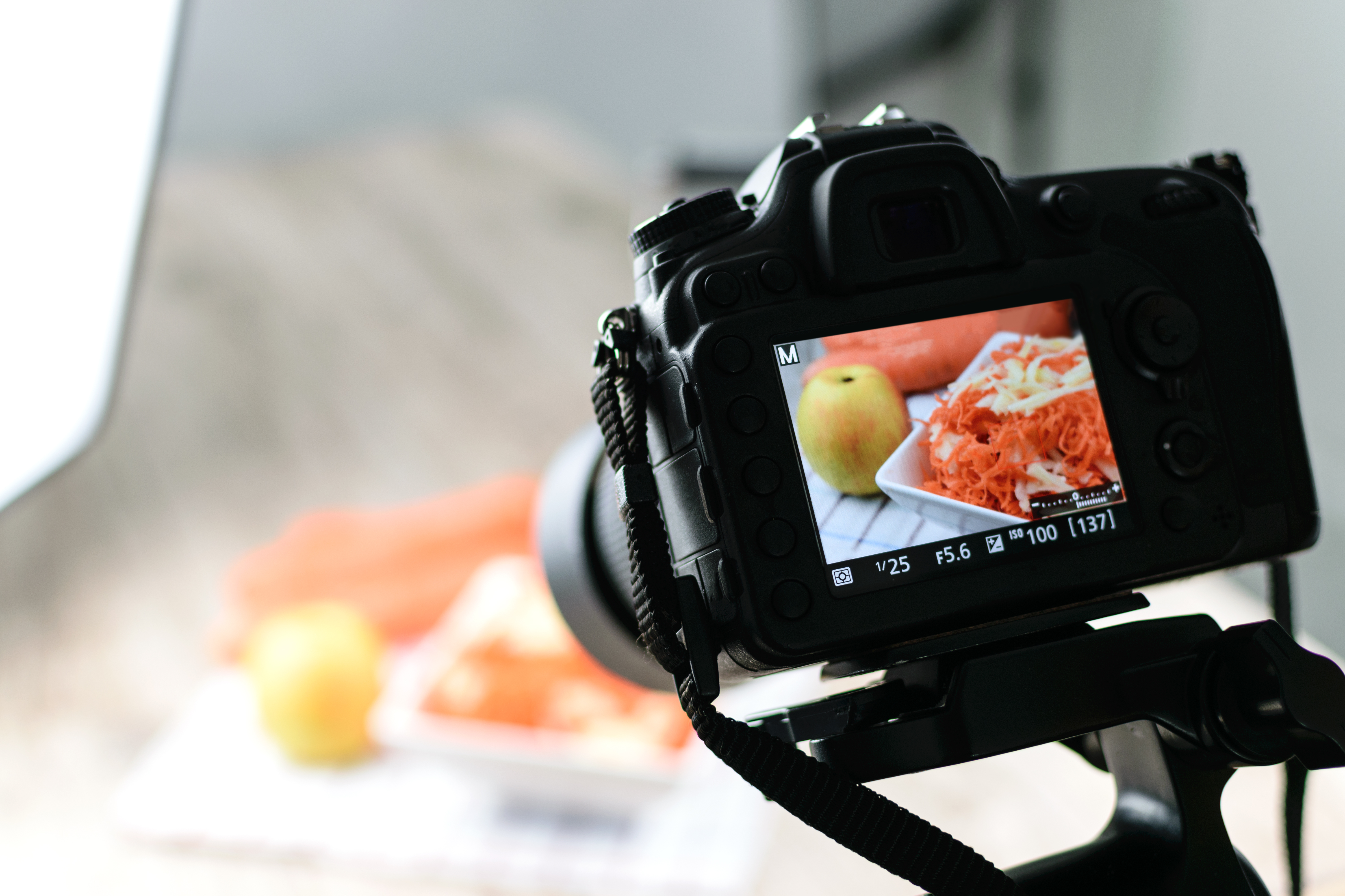 camera set up to take food photos, with image of food in the camera display