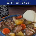 pin with white text on blue background on top and bottom and photo of slow cooker beef stew in a blue bowl with a biscuit and slow cooker and bottle of whiskey in the background