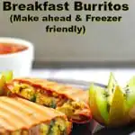 Healthy Mediterranean Breakfast Burritos on a plate with kiwi and salsal