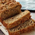 healthy carrot loaf sliced on a cutting board