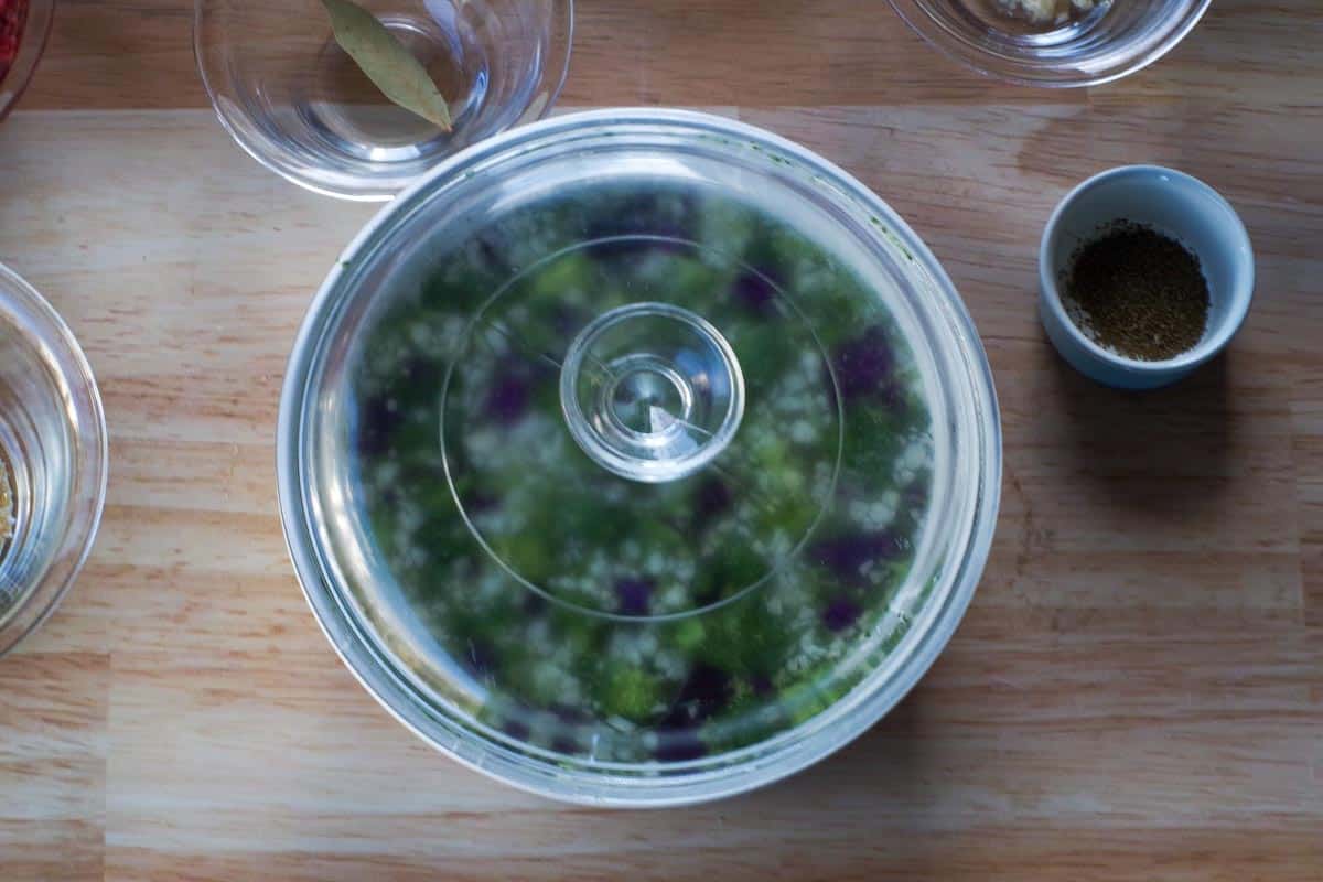 broccoli slaw in a microwave safe bowl with a lid