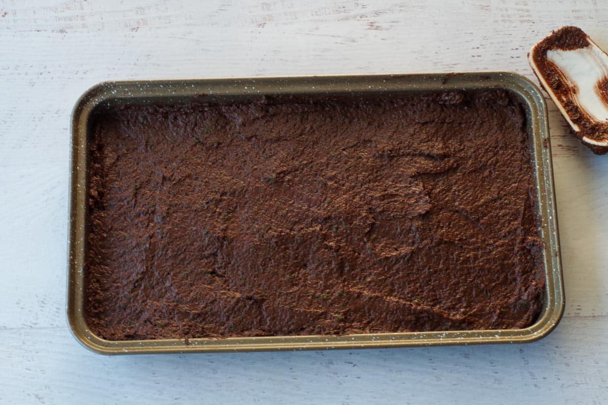 brownie batter spread into prepared pan