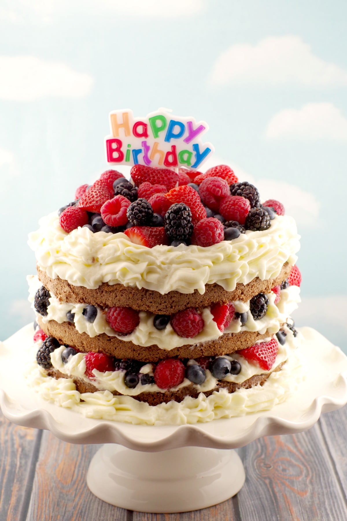 Chocolate Sponge Cake with whipped cream icing, chocolate mousse and summer berries