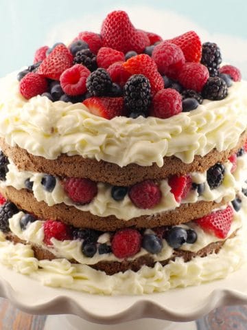 Italian Chocolate Sponge cake with summer berries, whipped cream icing and chocolate mousse