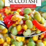 Corn Succotash being held up on a spoon.