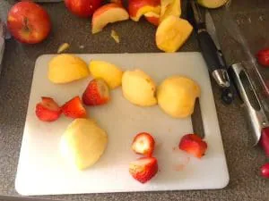 Fruit popsicle making step 1- cut bad parts off food