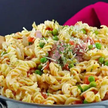 ham pasta in a pot with red napkin in the background