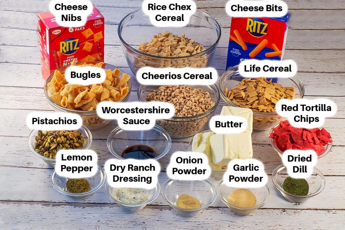 Ingredients in Savory Christmas Snack Mix in glass bowls, labelled (pretzels missing)