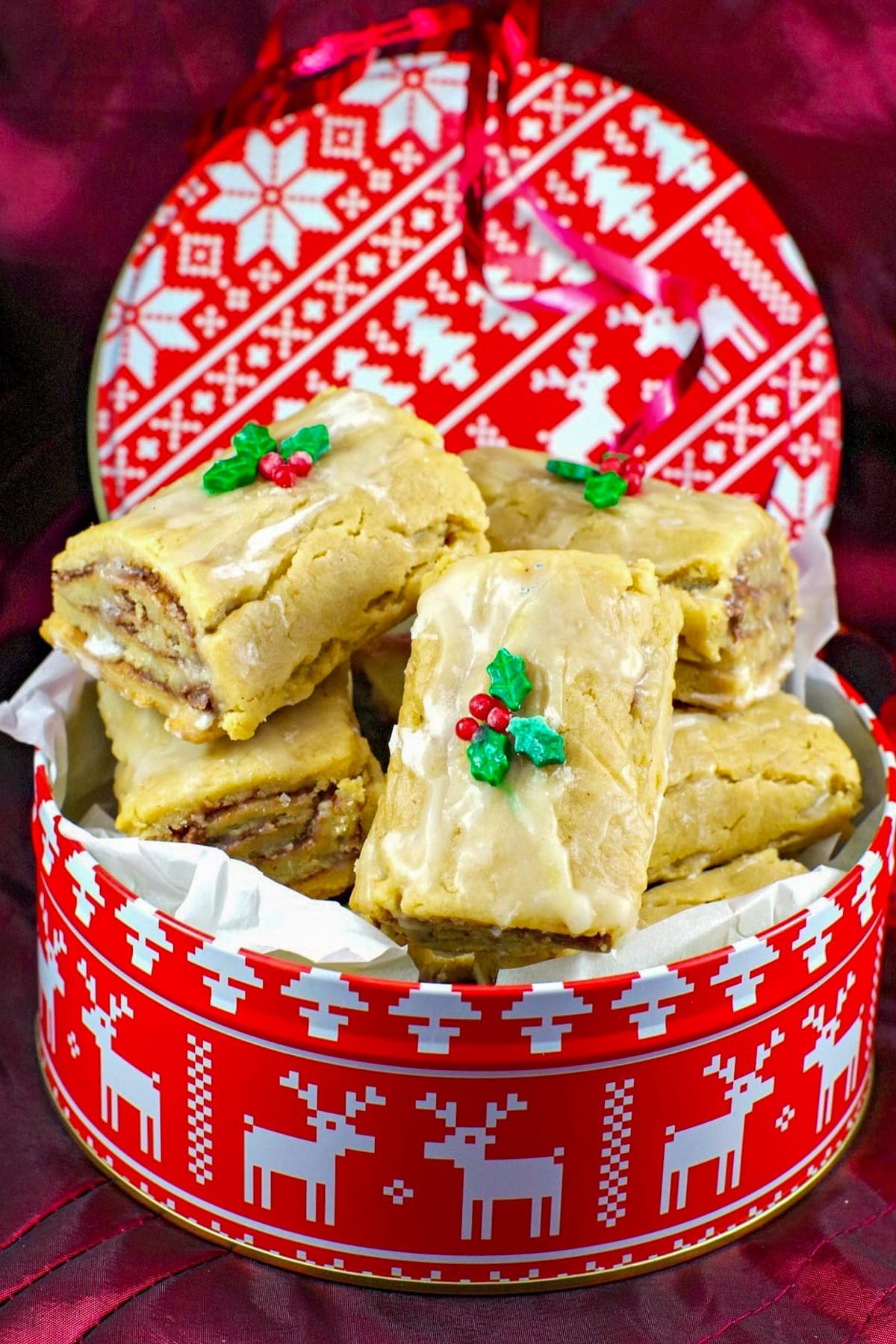 soft Gingerbread Yule log cookies in a red and white Christmas cookie tin