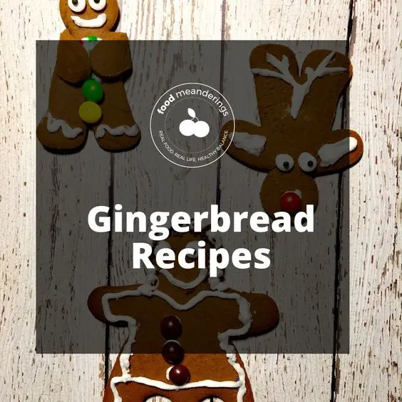 Pinterest gingerbread board cover with white writing on semi-transparent black background and gingerbread cookies in the background