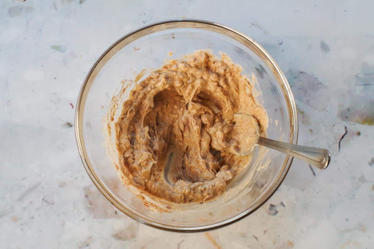 margarine and onion soup mix combined in medium glass bowl with spoon