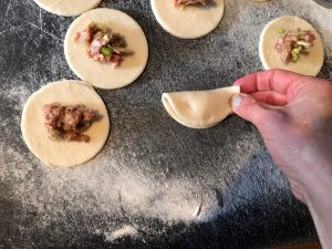 Chinese Potstickers - fold over, pinch and seal, as you would a perogy