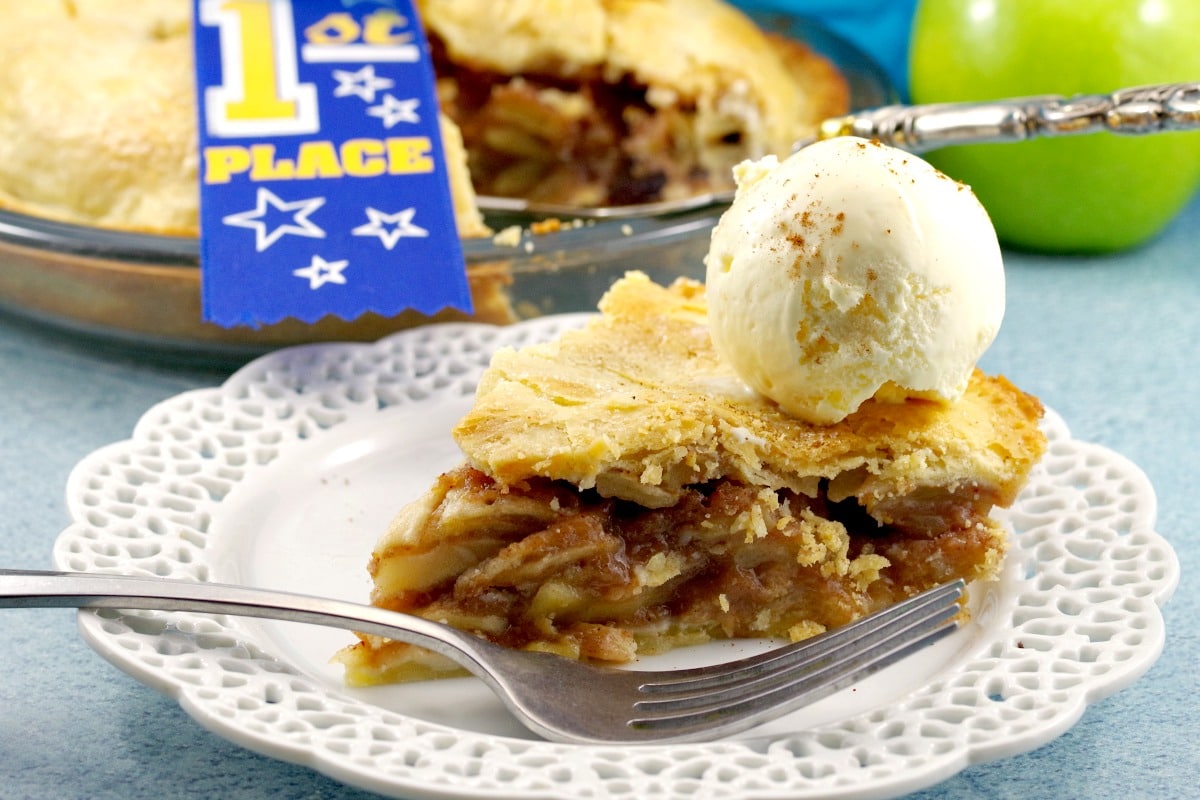 A piece of Deluxe apple pie with ice cream | award-winning apple pie