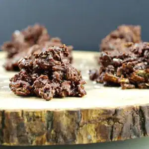 chocolate cereal clusters on wooden tree trunk platter