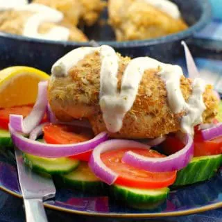 Greek Chicken breast Souvlaki with tzatziki drizzled on (with no pita and no skewer) on a bed of fresh vegetables