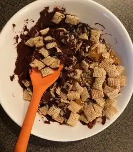 Chocolate and Cereal mixture being mixed in a bowl