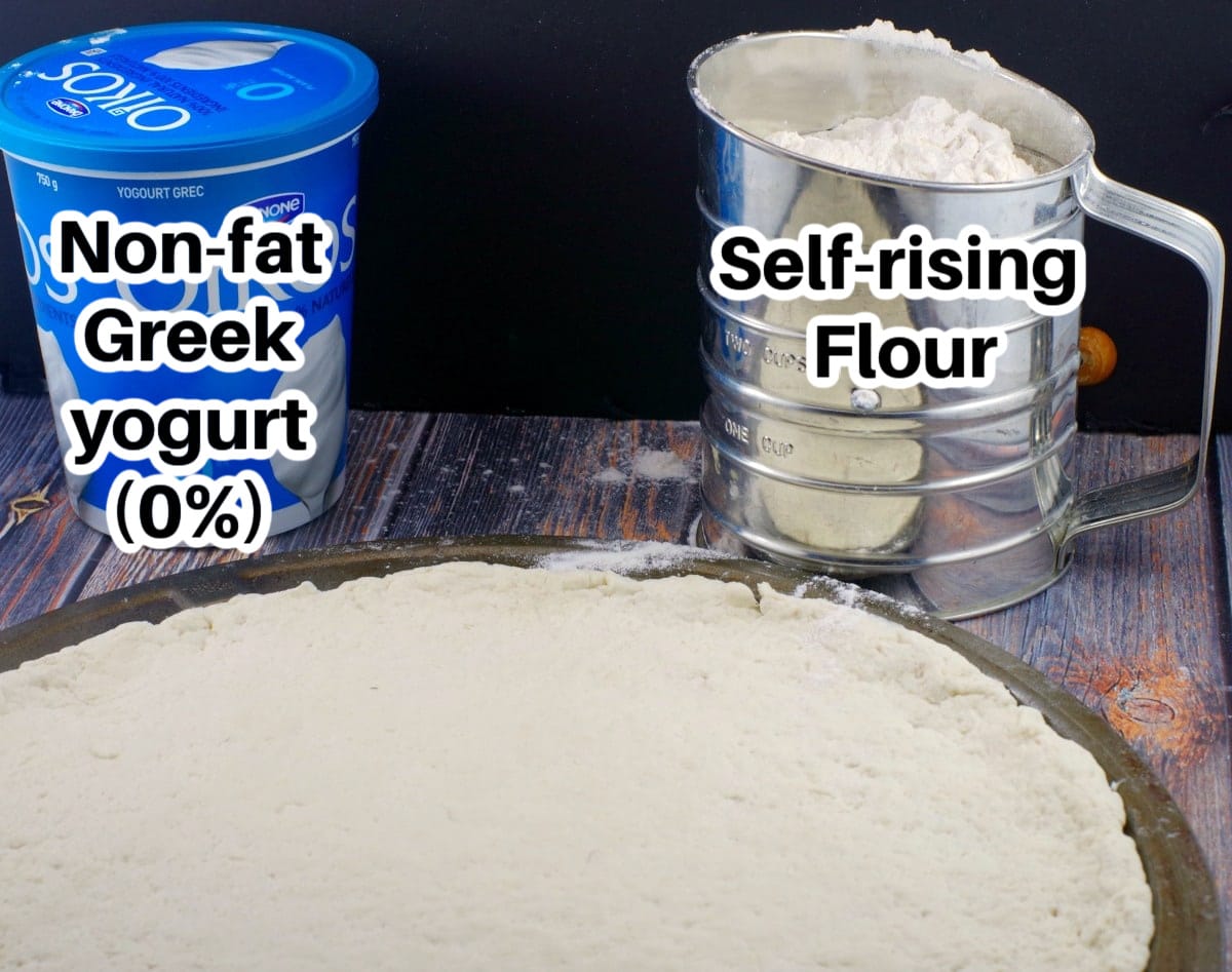 Greek yogurt and self rising flour, labelled with 2 ingredient pizza dough in front