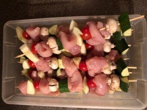 Meat and vegetables on kabobs with room left on end