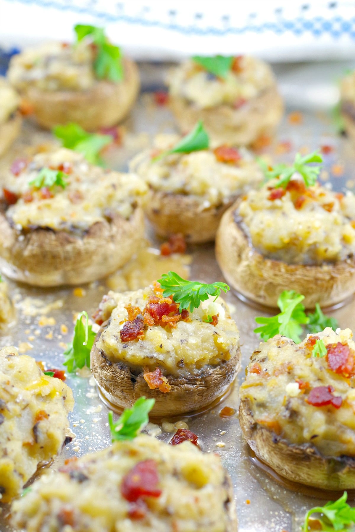 Pierogi stuffed mushrooms on aluminum foil lined baking sheet