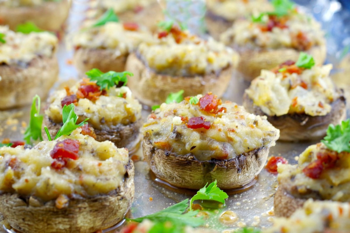 Pierogi stuffed mushrooms on aluminum foil lined baking sheet