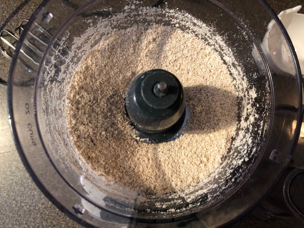 oats being ground for ihop pancakes in food processor