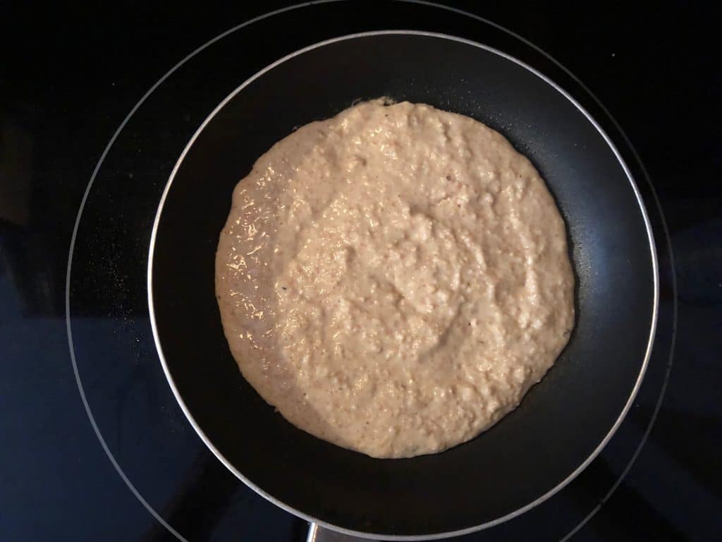 pancake batter in a frying pan