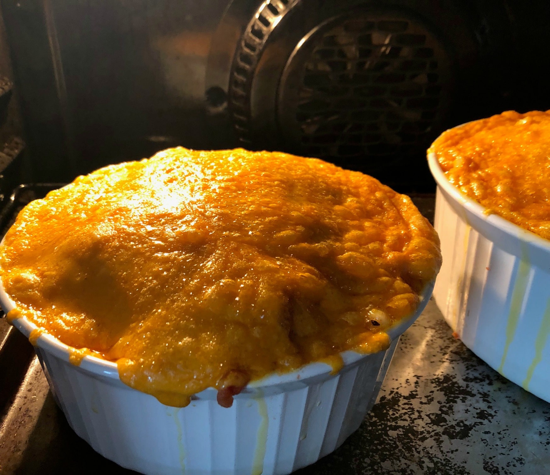 Mac and cheese with tomatoes baking in the oven