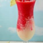 Miami Vice Mocktail with lime and cherry garnish