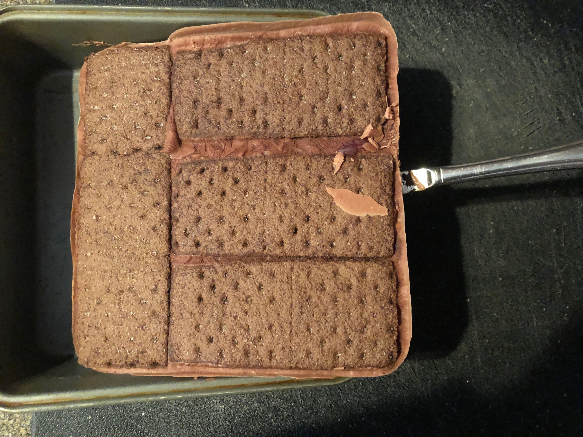 ice cream sandwiches being lifted out of pan