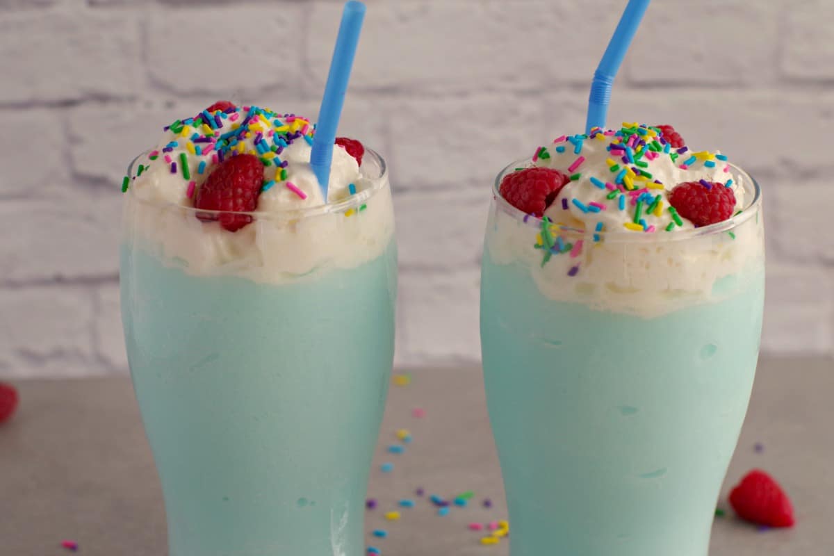 2 blue raspberry slushie drinks side by side