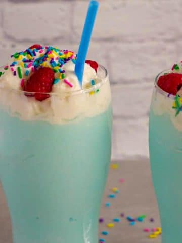 2 blue raspberry slushie drinks side by side
