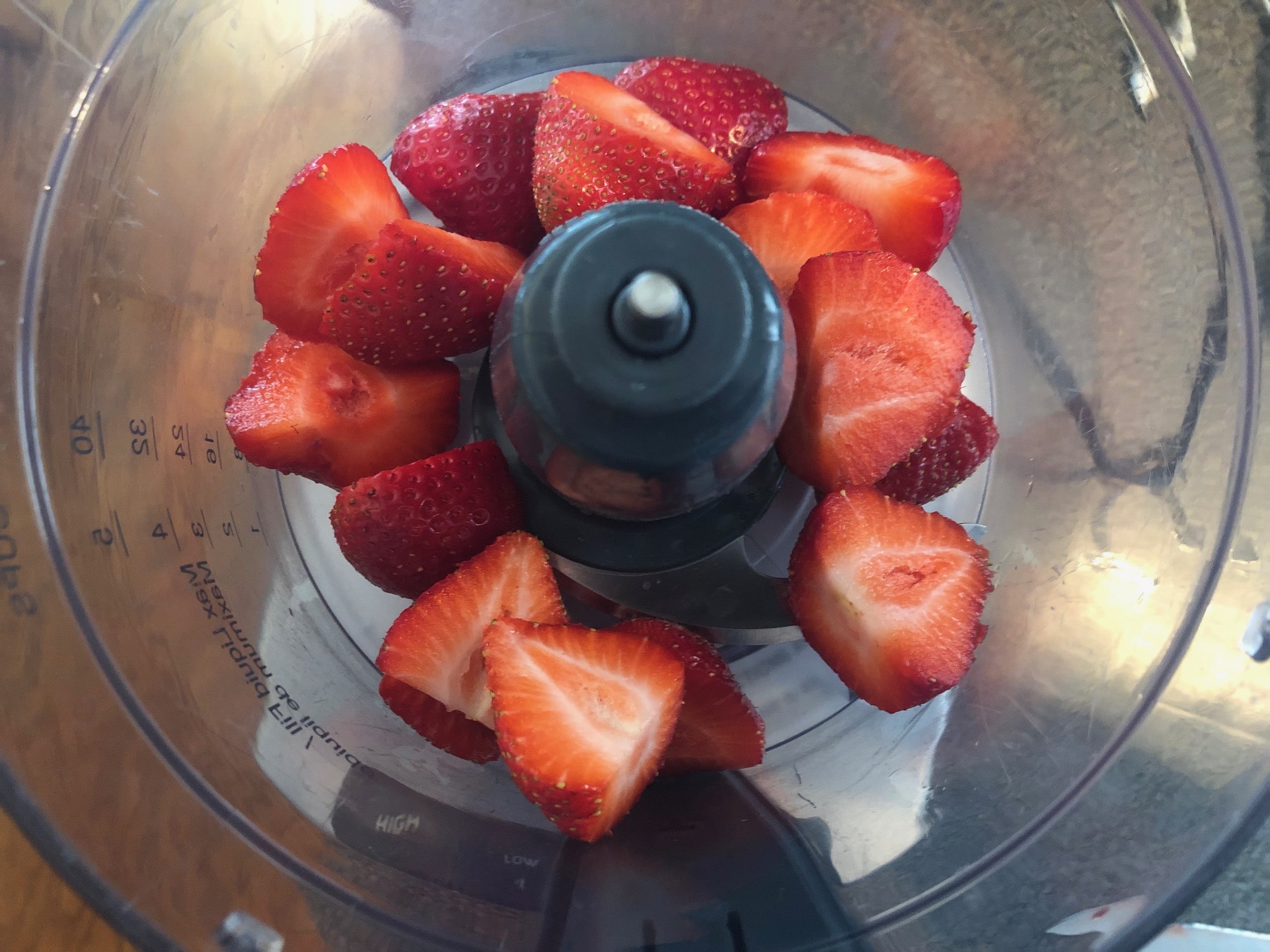 Strawberries hulled and chopped in food processor