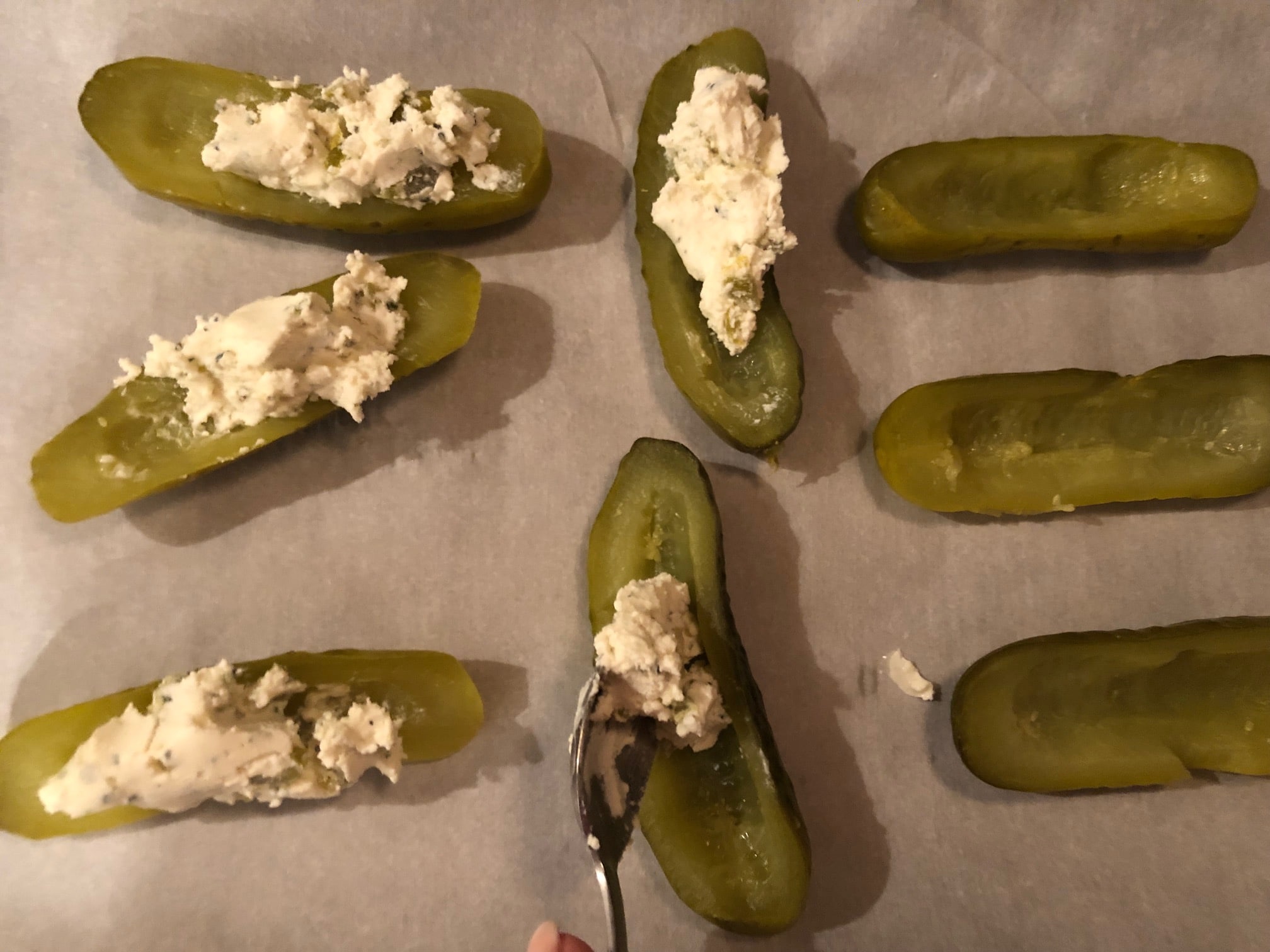 Boursin cheese mixture spooned into pickles