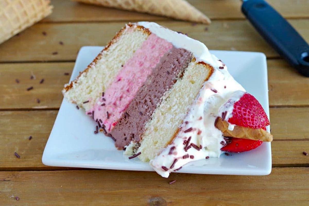 a slice of Neapolitan Ice Cream cakes on a white plate