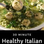 bowl of Italian Wedding soup with meatball being held up on spoon