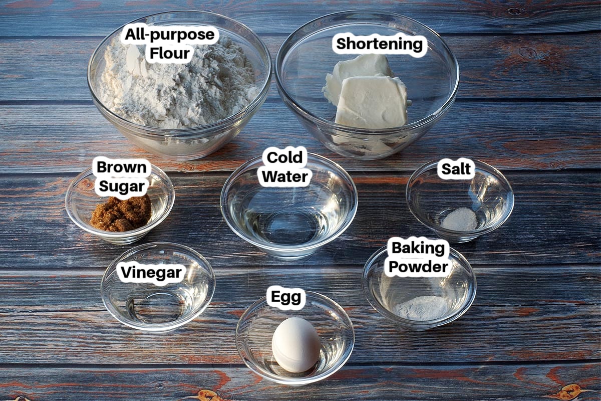 ingredients in no fail pie crust in glass bowls, labelled