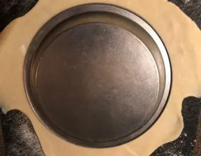 pie crust rolled out with pie plate on top