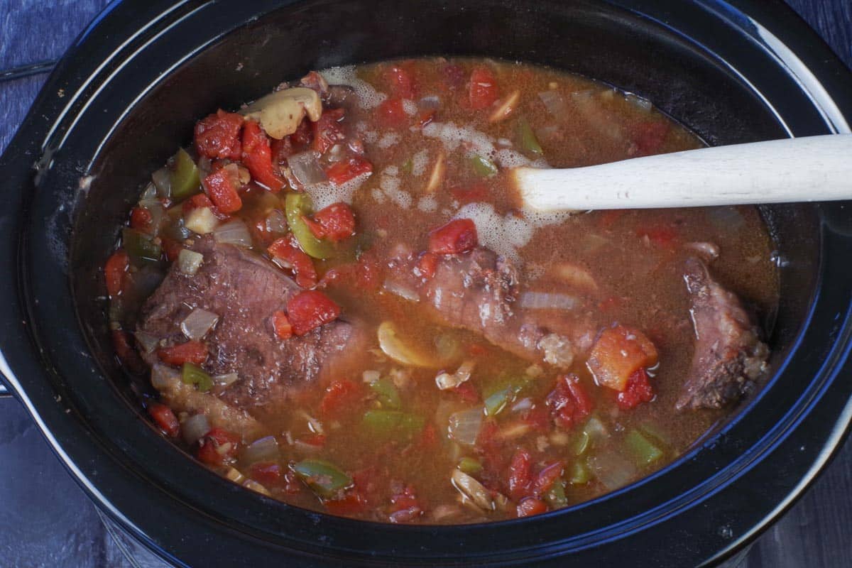 cooked swiss steak in a slow cooker