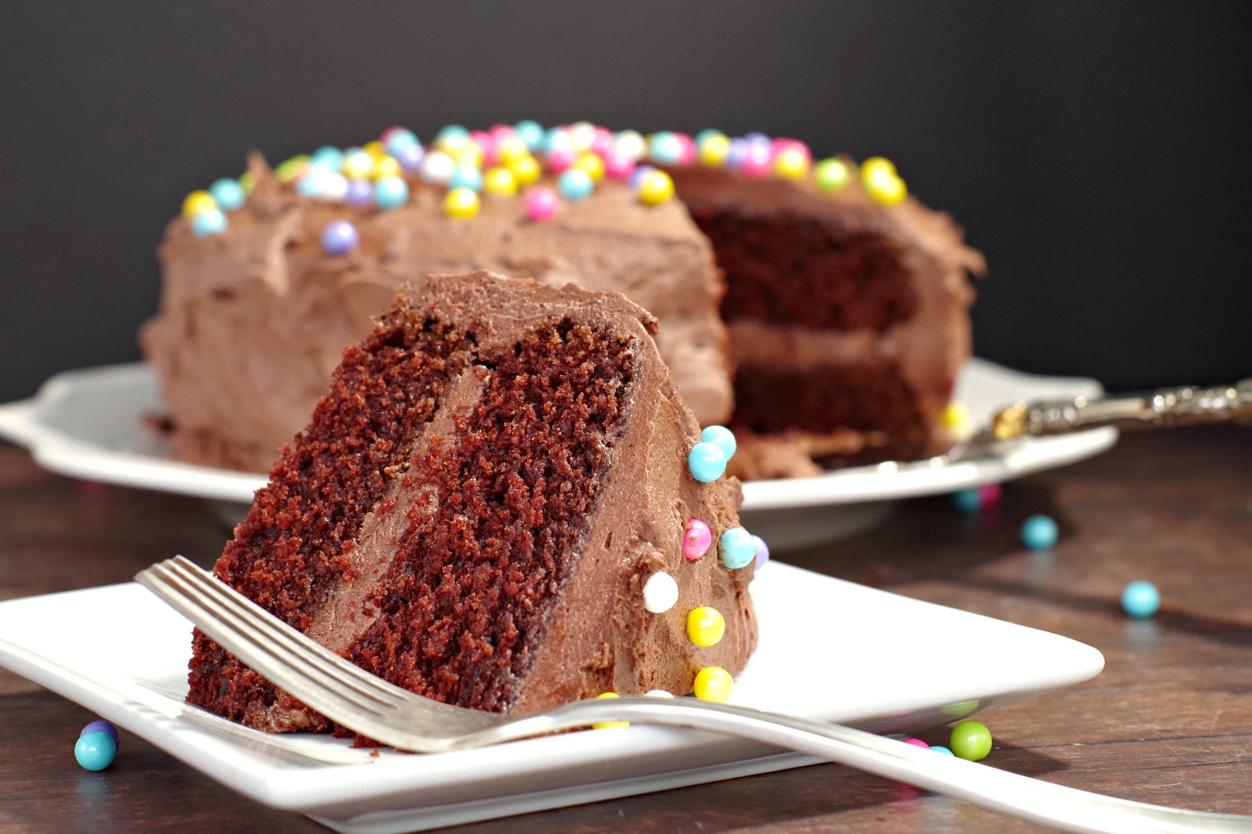 Chocolate Mayonnaise Cake with slice in front and cake in the back