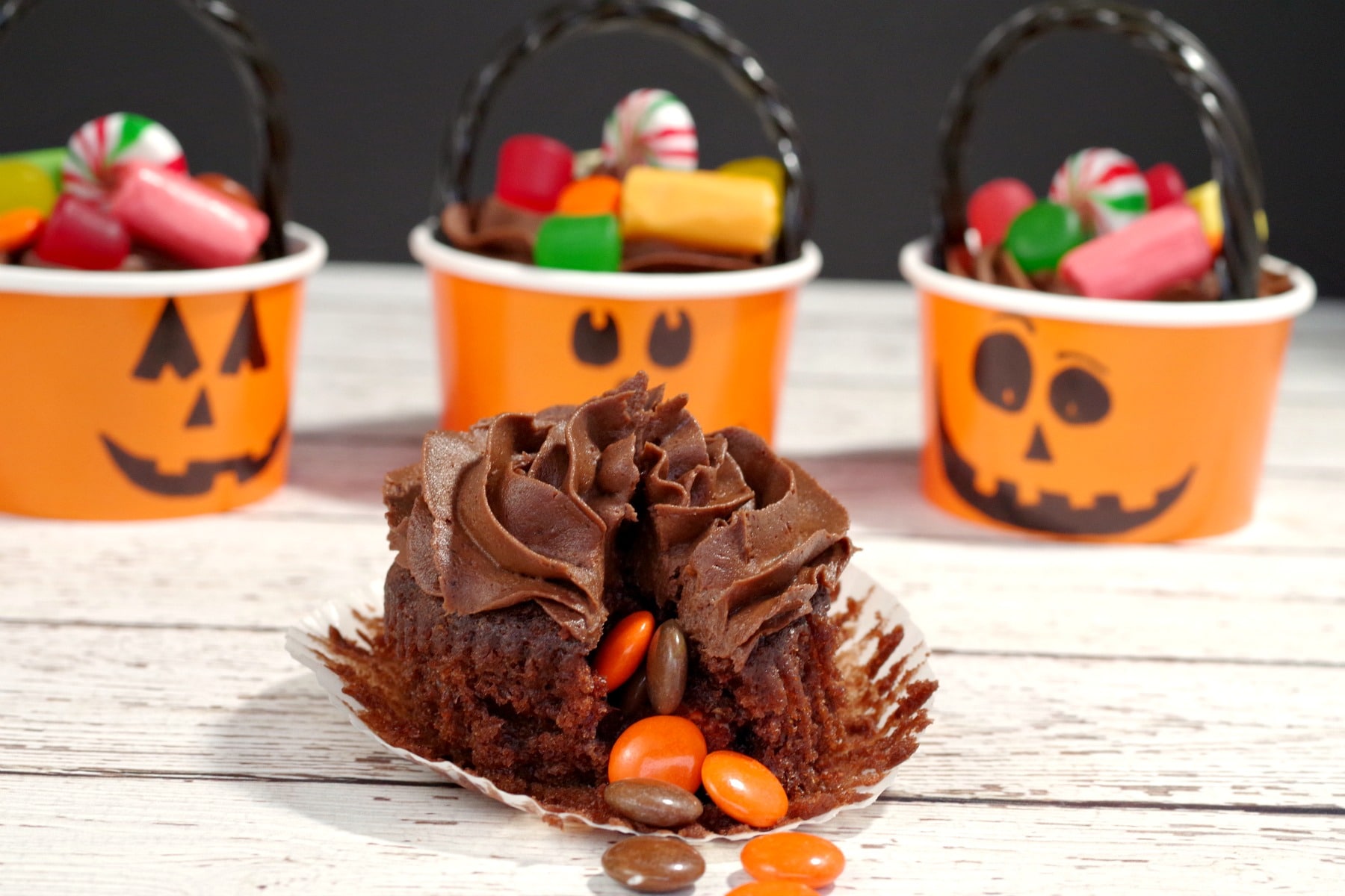 Halloween Pinata cupcake with candy spilling out of cupcake