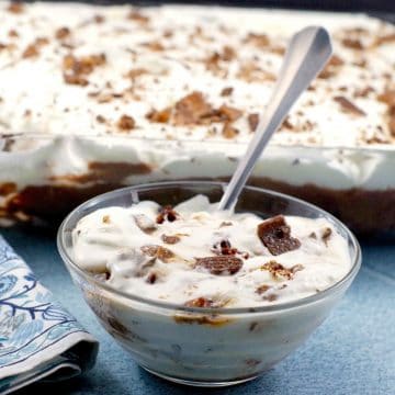 Bowl of Skor Bar Dessert in front and pan of Skor Bar dessert in background