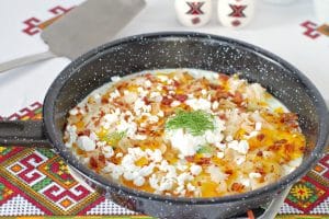 Ukrainian style eggs in frying pan