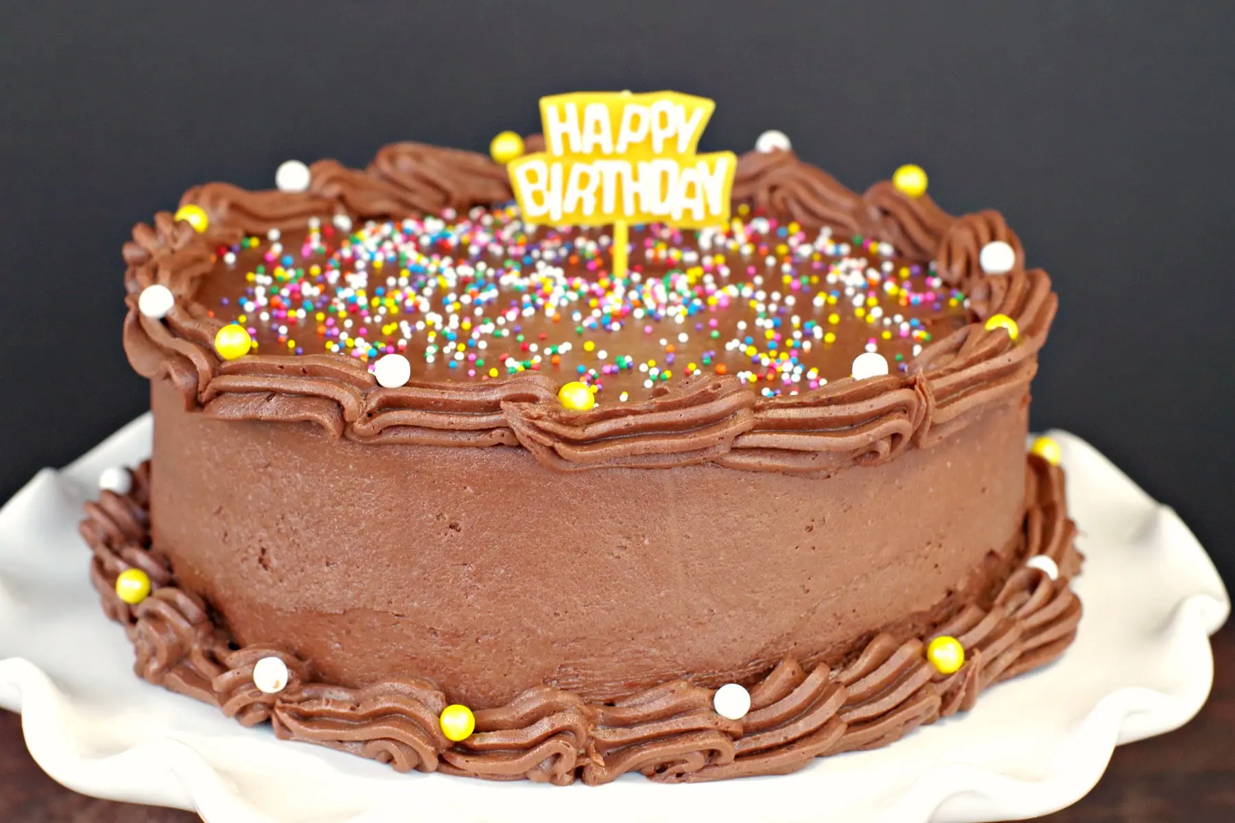 Happy birthday cake decorated with chocolate frosting without butter