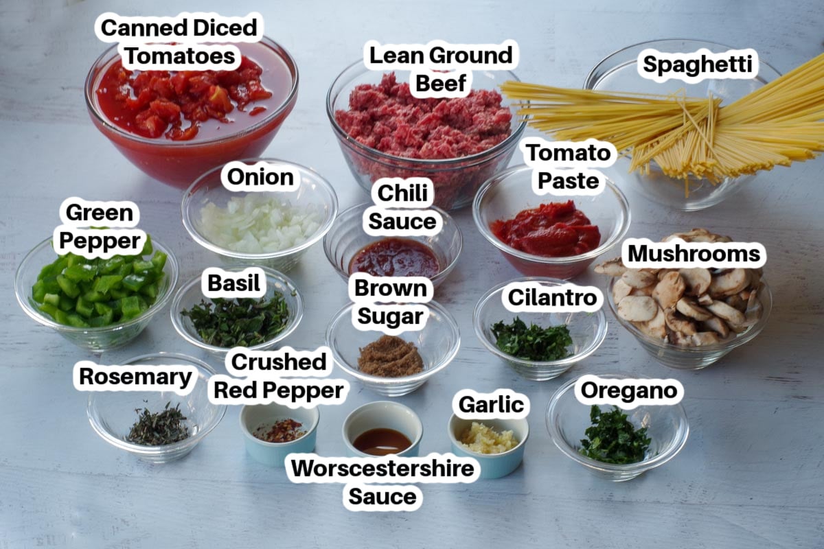 ingredients for secret ingredient spaghetti sauce in glass bowls, labelled