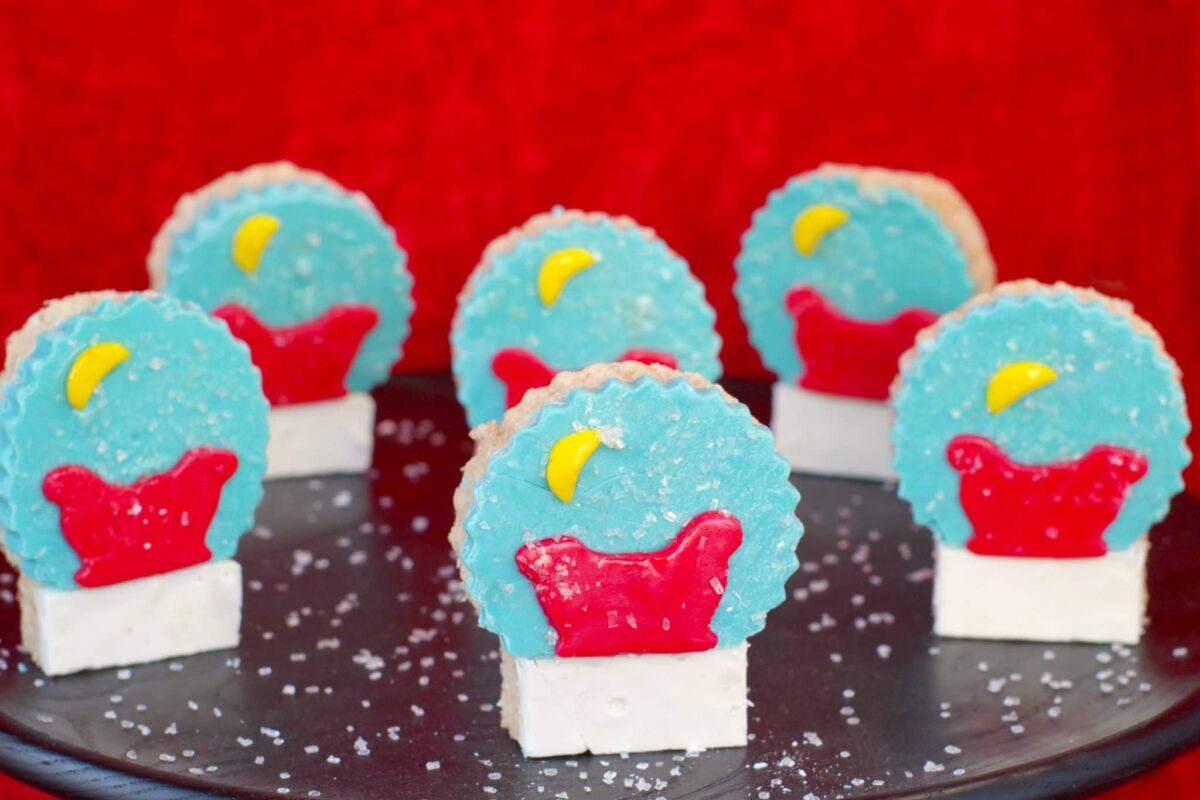 snow globe rice krispie treats on black tray